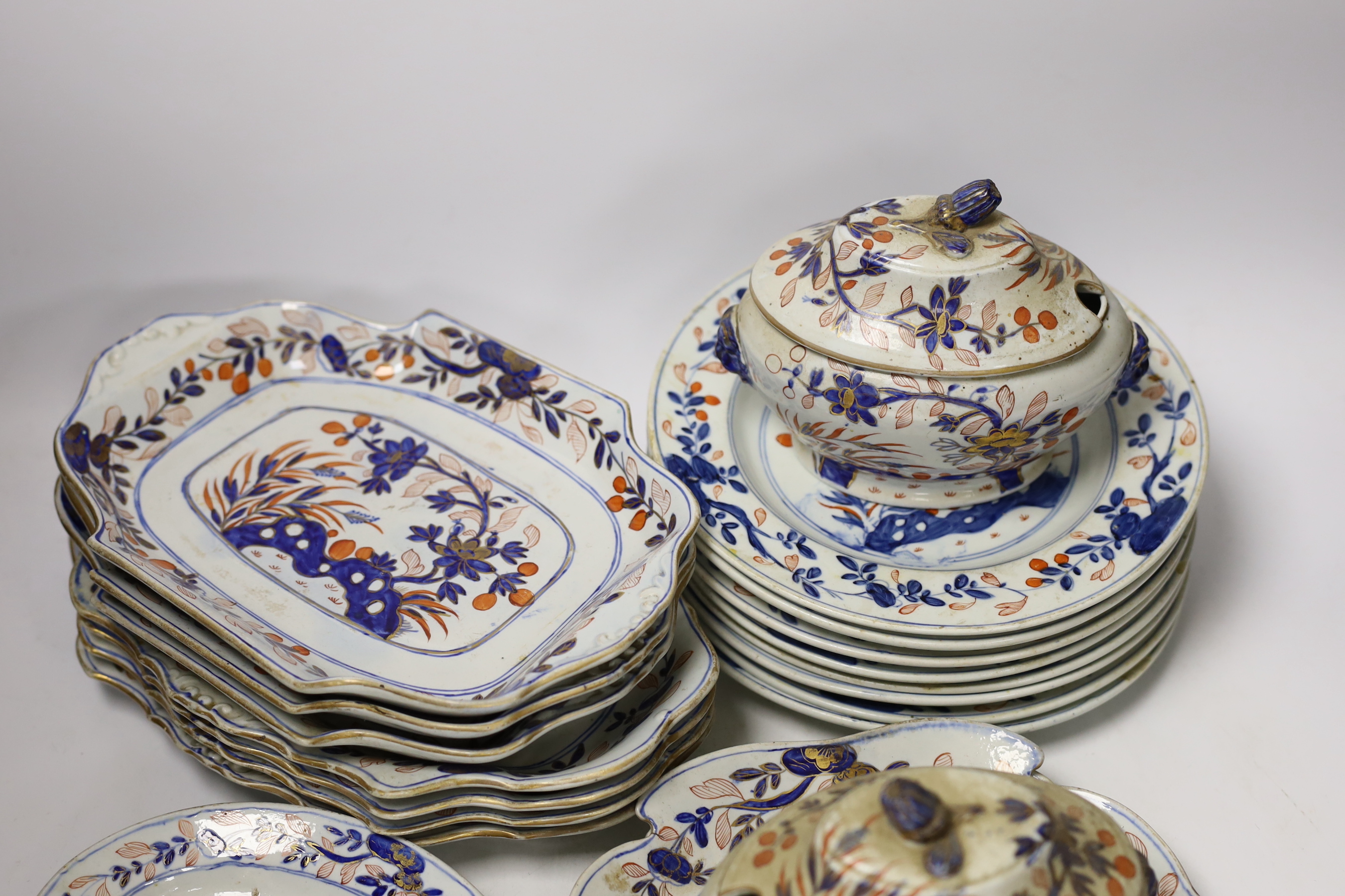 A Mason’s ironstone Japan pattern part dessert service, c.1815-20, including two lidded serving dishes, eight plates and eleven shaped dishes of various sizes, largest 29cm